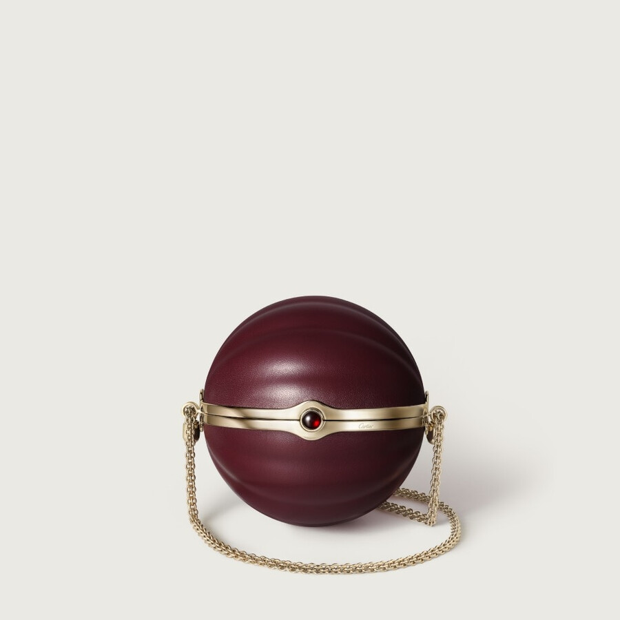 round bag with gadroon motif cartier soir