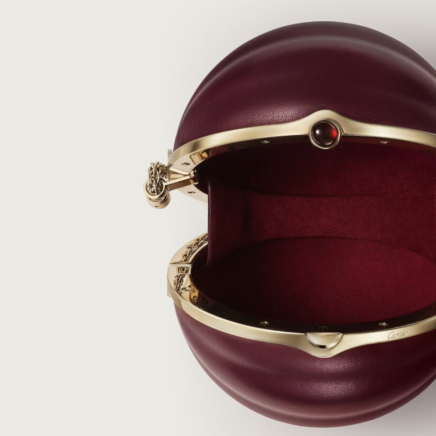 round bag with gadroon motif cartier soir