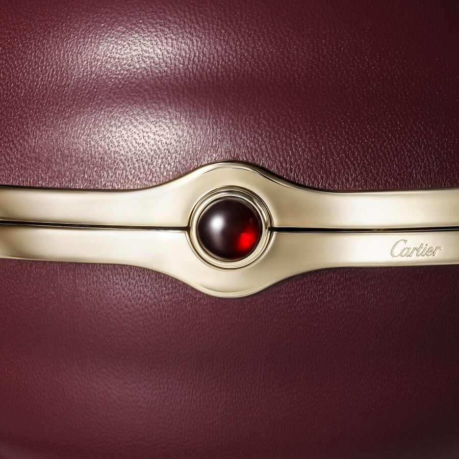 round bag with gadroon motif cartier soir